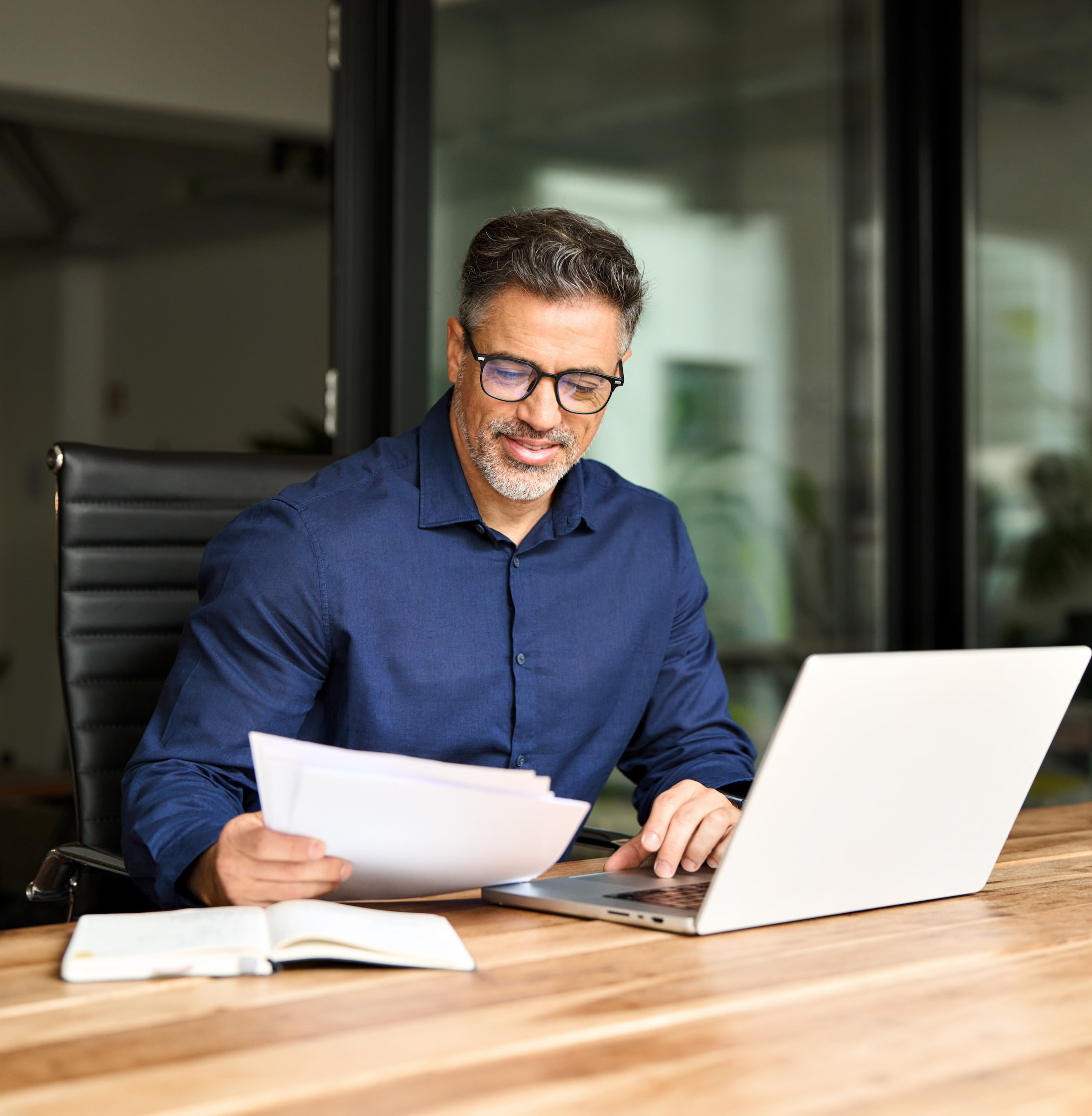 busy-mid-aged-professional-business-man-using-lapt-2024-08-10-18-11-35-utc-copy